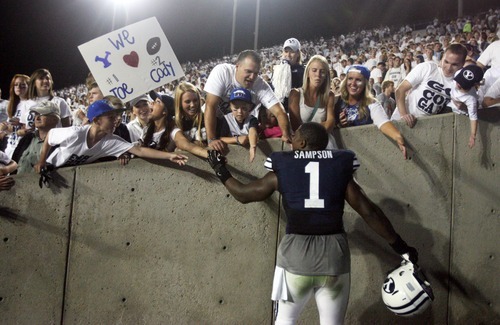 Kim Raff | The Salt Lake Tribune
Brigham Young Cougars defensive back Joe Sampson (1) talks with fans after BYU's home opener at LaVell Edwards Stadium in Provo, Utah on August 30, 2012.