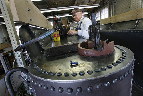 Scott Sommerdorf  |  The Salt Lake Tribune             
Dave Wagstaff drills holes in the structure of the tender for some of the 5,000 rivets in the restored vehicle. A group of volunteers in Ogden comes together every Saturday to work on restoring a narrow gauge locomotive at the Union Station Trainmen's Building, Saturday, September 8, 2012.
