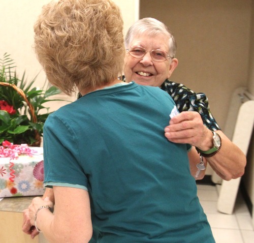 Rick Egan  | The Salt Lake Tribune 

  LaDean Nielsen hugs Merle Hansen (right) to congratulate her for her 41 years, Thursday, August 16, 2012. Hansen has been a store clerk at the JCPenney store in the Valley Fair Mall for 41 years. She was honored by her work colleagues on Thursday morning, before the store opened to customers.