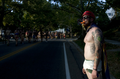 Kim Raff | The Salt Lake Tribune
Corbin Celotto encourages people in the 5k Utah Undie Run in Salt Lake City, Utah on September 9, 2012. Thousands of people gathered in hopes of breaking last years record of 2,270 people which was the largest gathering of people wearing only underpants.