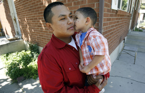 Francisco Kjolseth  |  The Salt Lake Tribune
Ernesto Perez, who turns 21 next month, spends time with his son Dominique, 2, at their home in Salt Lake. Ernesto is a success story of Stand a Little Taller (SALT) program, an anti-gang program in SLC that helps young men stay away from gang life and move towards being successful. Perez has been involved in sports programs and or structured SALT activities in the past that has helped him steer a better course in life.