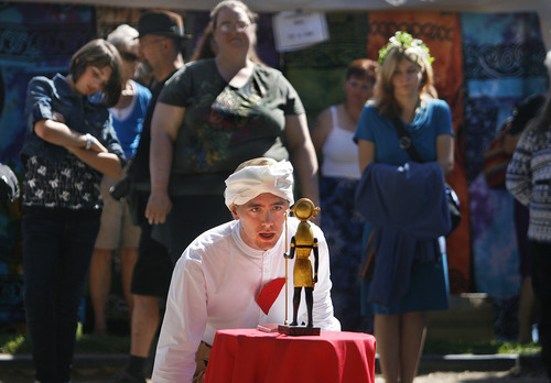 Scott Sommerdorf  |  The Salt Lake Tribune             
Matthew Szymanski takes part in a ceremony evoking the God Horus, during the Annual Pagan Pride Day at Murray Park, Sunday, September 9, 2012.