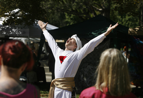Scott Sommerdorf  |  The Salt Lake Tribune             
Matthew Szymanski takes part in a ceremony evoking the God Horus, during the Annual Pagan Pride Day at Murray Park, Sunday, September 9, 2012.