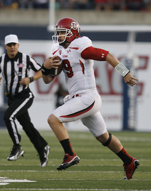 Utah quarterback Jon Hays scrambles for yardage late in the first half against Utah State during an NCAA college football game Friday, Sept. 7, 2012, in Logan, Utah. (AP Photo/The Salt Lake Tribune, Scott Sommerdorf) DESERET NEWS OUT  MAGS OUT