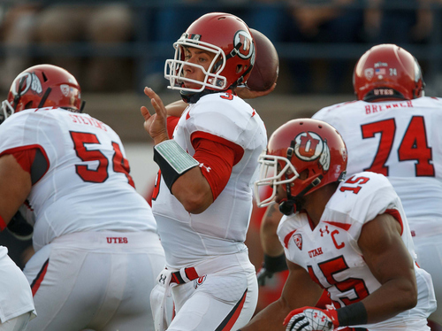 Utah's Jordan Wynn looks to pass during the first quarter against Utah State during an NCAA college football game Friday, Sept. 7, 2012, in Logan. (AP Photo/The Salt Lake Tribune, Trent Nelson)