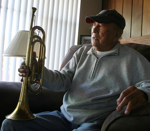 Steve Griffin |  The Salt Lake Tribune
George Murakami holds the bugle he played as a young man in Topaz, the internment camp for Japanese Americans northwest of Delta, from his home in Rose Park, Utah Tuesday September 4, 2012. The camp opened 70 years ago, and some of the camp's residents stayed in Utah permanently.