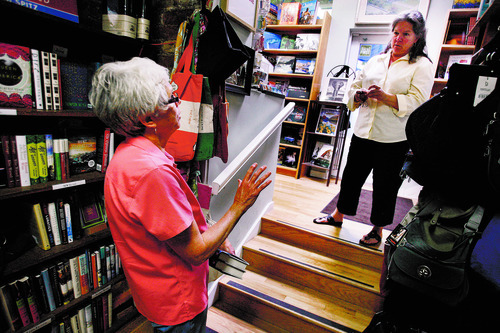 Scott Sommerdorf  |  The Salt Lake Tribune             
Employee Sue Fleming, left, speaks with Anne Holman at The King's English Bookshop, on Sept. 6, 2012. The store is marking its 35th year in business.