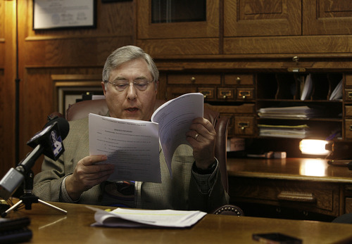 Scott Sommerdorf  |  The Salt Lake Tribune             
Attorney Robert Sykes reads through the lawsuit filed on behalf of Roger and Pam Mortensen. He then answered questions about the dismissal of their lawsuit during a press conference in his office in Salt Lake City, Monday, September 10, 2012.