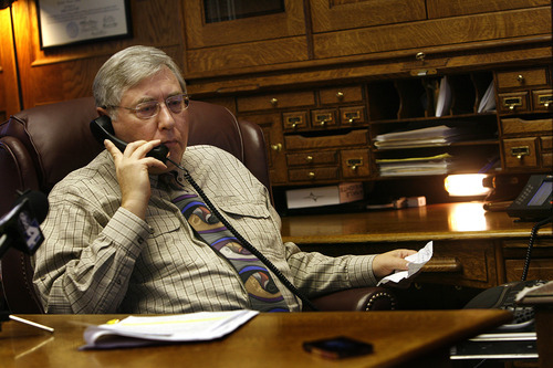 Scott Sommerdorf  |  The Salt Lake Tribune             
Attorney Robert Sykes speaks with Pam Mortensen over the phone to ask if she would take part in the press conference via telephone. She declined, and so Sykes answered questions about the dismissal of their lawsuit during a press conference in his office in Salt Lake City, Monday, September 10, 2012.