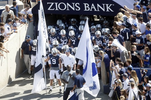Chris Detrick  |  The Salt Lake Tribune
Members of the BYU football team run onto the field before the game against Weber State at LaVell Edwards Stadium Saturday September 8, 2012.