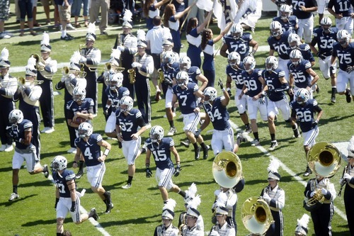 Chris Detrick  |  The Salt Lake Tribune
Members of the BYU football team run onto the field before the game against Weber State at LaVell Edwards Stadium Saturday September 8, 2012.