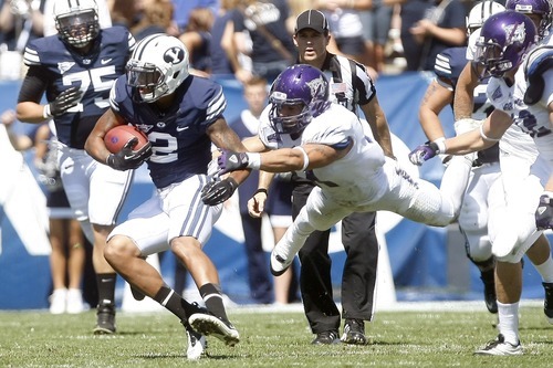 Chris Detrick  |  The Salt Lake Tribune
Brigham Young Cougars wide receiver Cody Hoffman (2) runs the ball past Weber State Wildcats linebacker Anthony Morales (44) during the first half of the game against Weber State at LaVell Edwards Stadium Saturday September 8, 2012. BYU won the game, 45-13.