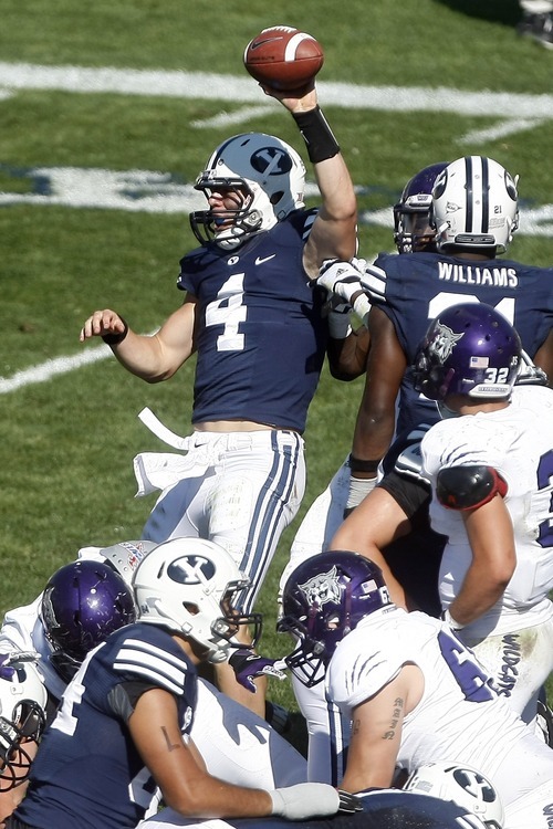 Chris Detrick  |  The Salt Lake Tribune
Brigham Young Cougars quarterback Taysom Hill (4) celebrates after scoring a touchdown during the second half of the game against Weber State at LaVell Edwards Stadium Saturday September 8, 2012. BYU won the game 45-13.