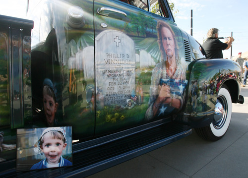 Steve Griffin | The Salt Lake Tribune


People look at a vintage truck restored by Julie and Dave Vinnedge in honor of their son, Lance Corporal Phillip David Vinnedge, who died while serving in Afghanistan, at Fairbourne Station Plaza, in West Valley City, Utah Tuesday September 11, 2012. The Vinnedge's fulfilled his dream of restoring a 1951 Chevy truck complete with murals honoring him, his family, his military colleagues and those lost on September 11, 2001. Lance Cpl. Vinnedge's parents now travel and display the truck in memory of their son. They will be in Camp Pendleton Sept. 13, 2012 to show the truck to his son's platoon. Phillip was deployed with the 3rd Battalion, 5th Marine Regiment to Afghanistan and on October 13, 2010 Phillip was driving the lead vehicle on a security patrol with Lcpl Victor Dew, Lcpl Joe Rodewald and Cpl Justin Cain when a large IED was remotely detonated killing all 4 instantly.