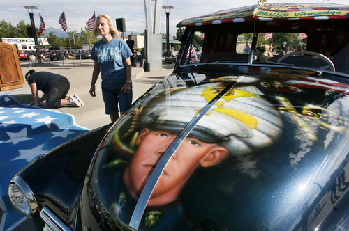 Steve Griffin | The Salt Lake Tribune


Julie Vinnedge, mother of Lance Corporal Phillip David Vinnedge, who died while serving in Afghanistan, gives people a tour of a vintage truck she, and her husband Dave Vinnedge, restored in honor of their son during an event at Fairbourne Station Plaza, in West Valley City, Utah Tuesday September 11, 2012. The Vinnedge's fulfilled his dream of restoring a 1951 Chevy truck complete with murals honoring him, his family, his military colleagues and those lost on September 11, 2001. Lance Cpl. Vinnedge's parents now travel and display the truck in memory of their son. They will be in Camp Pendleton Sept. 13, 2012 to show the truck to his son's platoon. Phillip was deployed with the 3rd Battalion, 5th Marine Regiment to Afghanistan and on October 13, 2010 Phillip was driving the lead vehicle on a security patrol with Lcpl Victor Dew, Lcpl Joe Rodewald and Cpl Justin Cain when a large IED was remotely detonated killing all 4 instantly. The four soldiers are painted on the driver side door pictured here.