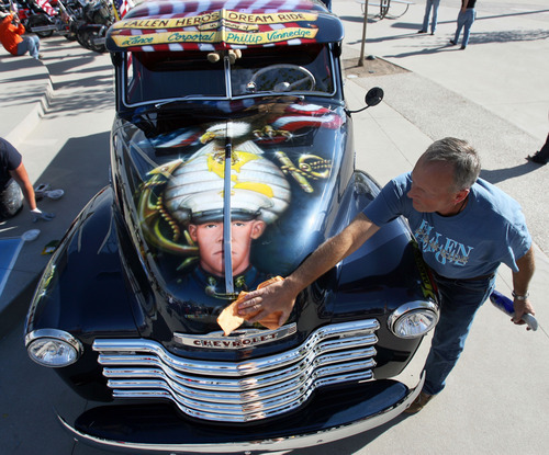 Steve Griffin | The Salt Lake Tribune


Dave Vinnedge, father of Lance Corporal Phillip David Vinnedge, who died while serving in Afghanistan, polishes the vintage truck he, and his wife, Julie Vinnedge, restored in honor of their son during an event at Fairbourne Station Plaza, in West Valley City, Utah Tuesday September 11, 2012. The Vinnedge's fulfilled his dream of restoring a 1951 Chevy truck complete with murals honoring him, his family, his military colleagues and those lost on September 11, 2001. Lance Cpl. Vinnedge's parents now travel and display the truck in memory of their son. They will be in Camp Pendleton Sept. 13, 2012 to show the truck to his son's platoon. Phillip was deployed with the 3rd Battalion, 5th Marine Regiment to Afghanistan and on October 13, 2010 Phillip was driving the lead vehicle on a security patrol with Lcpl Victor Dew, Lcpl Joe Rodewald and Cpl Justin Cain when a large IED was remotely detonated killing all 4 instantly.