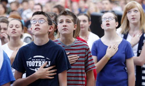 Al Hartmann  |  The Salt Lake Tribune
Students recite the Pledge of Allegiance after raising the American flag in a Sunrise Salute to Patriots at South Jordan Middle School on Tuesday. Students sang a number of patriotic songs as they  gathered around the flag pole in a tribute to 9/11 victims.