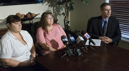 Paul Fraughton |  The Salt Lake Tribune
BettyJean Smith, left, and Connie Rayborn with their attorney Ron J. Kramer talk Sept. 11, 2012, about the lawsuit they filed against the Boy Scouts of America in regard to the death of Connie's son David Rayborn and the injury of Sean Smith, BettyJean's son. The boys were struck by lightning at a Boy Scout camp a year ago.