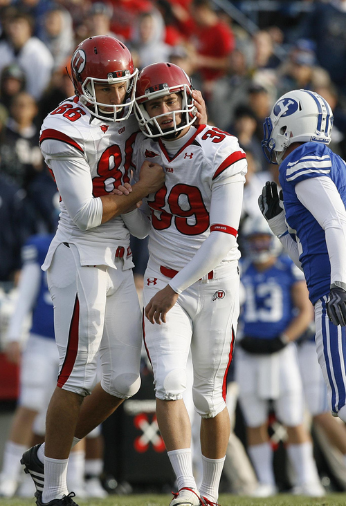 Scott Sommerdorf | The Salt Lake Tribune

Utah kicker Joe Phillips (39) is congratulated by Utah kicker Sean Sellwood (86) after Phillips scored a field goal during the first quarter of the BYU Utah game at Lavell Edwards Stadium in Provo, Utah, Saturday, November 28, 2009.
