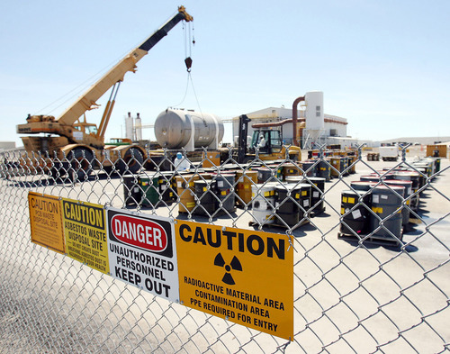 Tribune file photo
Workers unload a container at the EnergySolutions disposal site in Clive, Utah. State oversight of the operations came fire in a legislative audit released Tuesday.