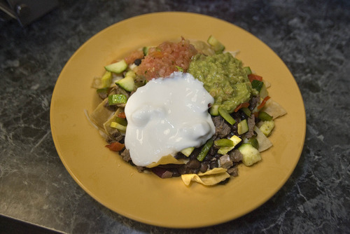 Paul Fraughton | The Salt Lake Tribune
The deluxe half and half nachos with steak and roasted vegetables at Mountain West Burrito in Provo.
