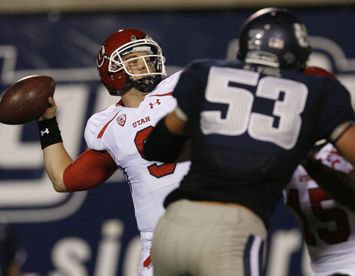 Scott Sommerdorf  |  The Salt Lake Tribune             
Utah QB Jon Hays throws during second half play. He finished 12 for 26 and a TD after replacing Jordan Wynn. The USU Aggies beat Utah 27-20 in OT, Friday, September 7, 2012.