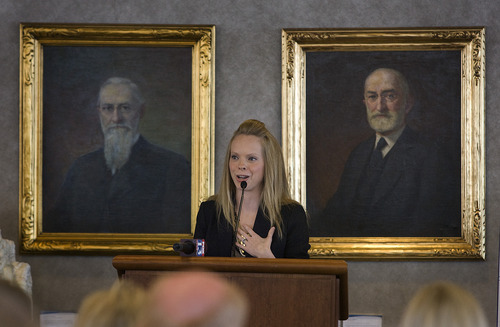 Scott Sommerdorf  |  The Salt Lake Tribune             
Deondra Brown speaks after having accepted the 2012 Champion Against Child Abuse award on behalf of the Brown children from Bonnie Peters, at a fundraising luncheon for the Family Support Center at Zions Bank in Salt Lake City, Thursday, September 13, 2012. On the wall behind Brown are portraits of two of the former prophets of the LDS Church.