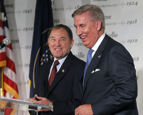 Al Hartmann  |  The Salt Lake Tribune
Democrat Peter Cooke, right, and Gov. Gary Herbert, a Republican, share a chuckle Friday during a gubernatorial debate that contained some sharp back-and-forth between the candidates.