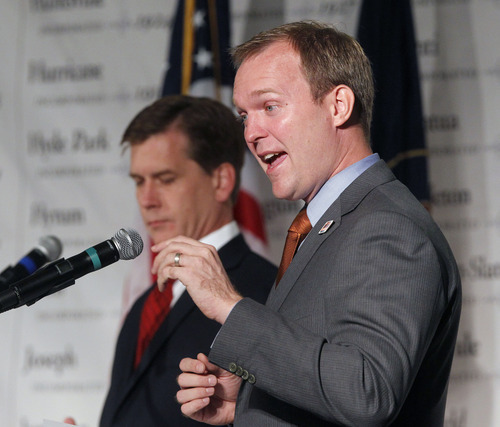Al Hartmann  |  The Salt Lake Tribune
Candidates for Salt Lake County mayor,  Mark Crockett, left,  and Ben McAdams debate at the Utah League of Cities and Towns annual conference Friday September 14.