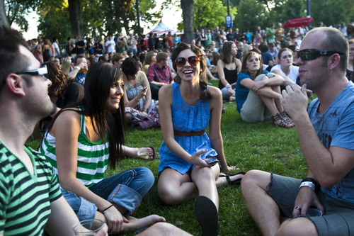 Chris Detrick  |  The Salt Lake Tribune 

(L-R) Shawn Wood, Tiara Fowers, Lindsay Fowers and Jeff Holdaway watch the 'She and Him' performance at the final Twilight Concert at Pioneer Park Thursday August 26, 2010.
