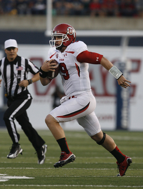 Scott Sommerdorf  |  The Salt Lake Tribune             
Utah QB Jon Hays scrambles for yardage late in the first half. The drive resulted in Utah's only points - a FG - prior to halftime. The USU Aggies held a 13-3 lead over Utah at the half, Friday, September 7, 2012.