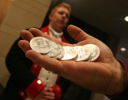 Leah Hogsten  |  The Salt Lake Tribune
Utah's Freedom Conference attendees paid their conference fees with a silver dollar, waiving the $45 conference registration fee, September 15, 2012. At rear is Corbin LeBaron of the Sons of the American Revolution.