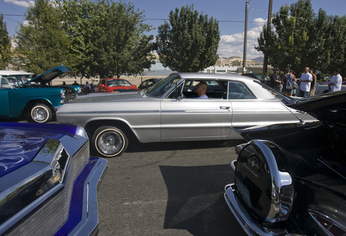 Kim Raff | The Salt Lake Tribune
Como Te Gusta car club member Benny Urcino drives his 1964 Chevrolet SS Impala into the low rider car show at the El Grito de la Independencia, Mexico's official independence day, celebration and car show at Centro Civico Mexicano in Salt Lake City, Utah on September 16, 2012.
