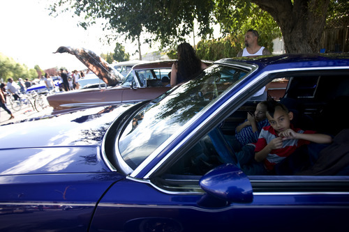 Kim Raff | The Salt Lake Tribune
(right) Carlos Herrera Jr. sits with his siter Marivel Herrera in their father 81 Buick Regal during theEl Grito de la Independencia, Mexico's official independence day, festival and low rider car show at Centro Civico Mexicano in Salt Lake City, Utah on September 16, 2012.