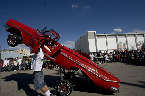 Kim Raff |  The Salt Lake Tribune
Gary Smith hops his 1961 Chevrolet Impala 82 inches in the air during the El Grito de la Independencia, Mexico's official independence day, festval and low-rider car show at Centro Civico Mexicano in Salt Lake City, Utah on September 16, 2012.