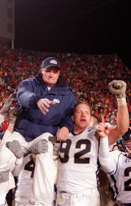 Trent Nelson | The Salt Lake Tribune

BYU coach LaVell Edwards is held aloft by his team, including #92 defensive end Ryan Denney, after a last-minute victory over Utah to end Edwards' career on Nov. 24, 2000.
