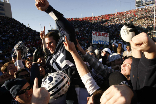 Trent Nelson | The Salt Lake Tribune
BYU fans hold Brigham Young quarterback Max Hall (15) on their shoulders, celebrating victory as BYU defeats the University of Utah 17-10 at BYU's LaVell Edward Stadium on Nov. 24, 2007.