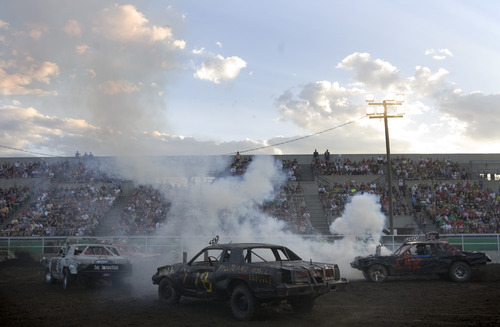 Kim Raff |  The Salt Lake Tribune
People compete in a heat during the Demolition Derby on the last day of the Utah State Fair in Salt Lake City on Sept. 16, 2012.