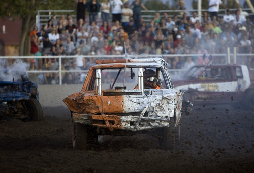 Kim Raff |  The Salt Lake Tribune
Ryan Sweet, driving #57, competes in a heat at the Demolition Derby on the last day of the Utah State Fair in Salt Lake City on Sept. 16, 2012.