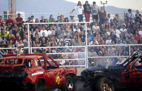 Kim Raff |  The Salt Lake Tribune
A sold-out crowd watches the Demolition Derby on the last day of the Utah State Fair in Salt Lake City on Sept. 16, 2012.