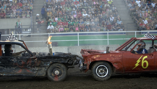 Kim Raff |  The Salt Lake Tribune
Zack Carter, left, and Dalton Gullo collide during the Demolition Derby on the last day of the Utah State Fair in Salt Lake City on Sept. 16, 2012.