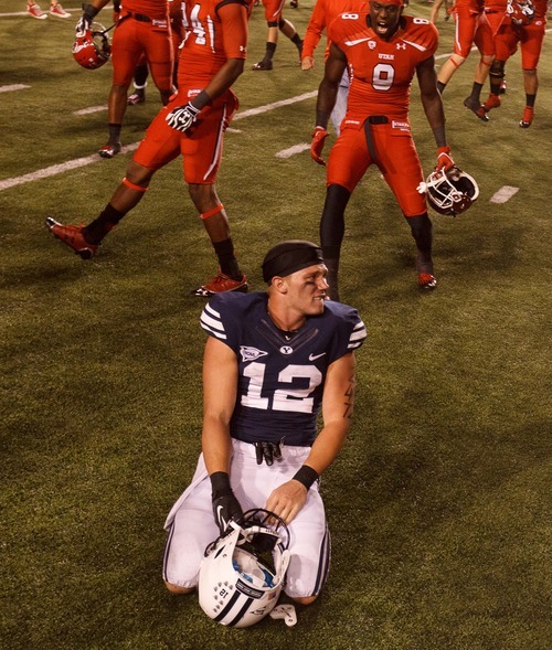 Trent Nelson  |  The Salt Lake Tribune
Brigham Young wide receiver JD Falslev (12) reacts to the loss as Utah hosts BYU college football in Salt Lake City, Utah, Saturday, September 15, 2012.