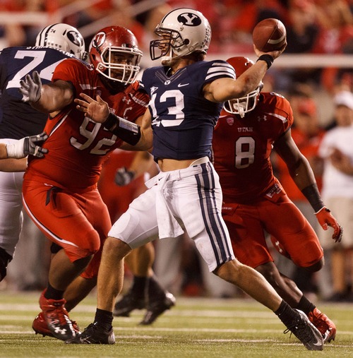 Trent Nelson  |  The Salt Lake Tribune
Utah defensive tackle Star Lotulelei (92) closes in on Brigham Young quarterback Riley Nelson (13) during the game in Salt Lake City on Saturday, Sept. 15, 2012.