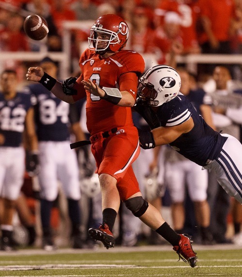 Trent Nelson  |  The Salt Lake Tribune
Utah quarterback Jon Hays fumbles the ball out of bounds under pressure from Brigham Young linebacker Kyle Van Noy during the game in Salt Lake City on Saturday, Sept. 15, 2012.