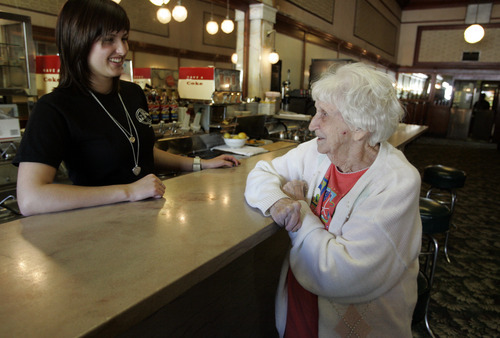 Tribune file photo
Server Tracy Hatfield of Perry, left, visits with Edna Romer of Brigham City at the Idle Isle in this 2009 file photo. Romer worked at the cafe when she was 17 years old.