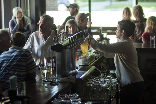 Chris Detrick  |  The Salt Lake Tribune
Bartender Katie Selin pours a beer at Dick N' Dixie's Friday May 11, 2012.