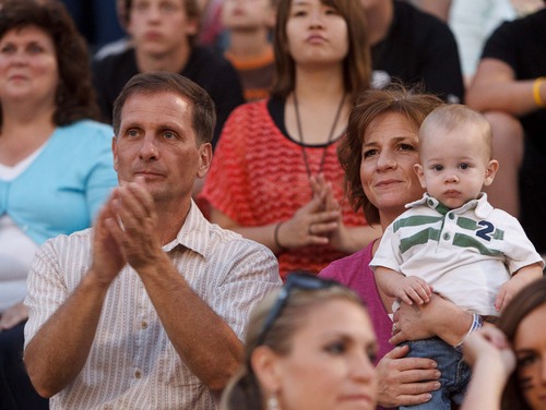 Trent Nelson  |  The Salt Lake Tribune
Chris Stewart, who is running for the 2nd Congressional District, and his wife, Evie (holding their grandson Chase Stewart), watch and cheer their daughter in a halftime dance performance at a Viewmont High-Davis High football game in Bountiful on a recent Friday night.