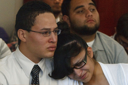 Leah Hogsten  |  The Salt Lake Tribune
Esteban Saidi's brother Erick Saidi (left) and sister weep in court as they listen to Ricky Angilau as he expresses his remorse for killing their brother. Ricky Angilau, who was 16-years-old when he fired into a crowd during a fight, killing an onlooker, was sentenced to up to 5 years in prison before 3rd District Judge William Barrett on Tuesday, September 18, 2012. Angilau was charged as a juvenile for shooting and killing a Kearns High classmate, 16-year-old Esteban Saidi, on Jan. 21, 2009.
who was