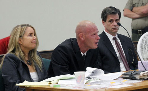 Al Hartmann  |  The Salt Lake Tribune
Eric Charlton sobs during his preliminary hearing in Judge James Brady's Fourth District Court in Nephi Wednesday September 19.  He is comforted by his defense lawyers Susanne Gustin, left, and Andy Deiss, right.     He is charged with one count of manslaughter, a second-degree felony; reckless endangerment, a class A misdemeanor; and carrying a dangerous weapon under the influence of alcohol/drugs, a class B misdemeanor, for the accidental shooting death of his 17-year-old brother, Cameron Bryce Charlton, May 28.