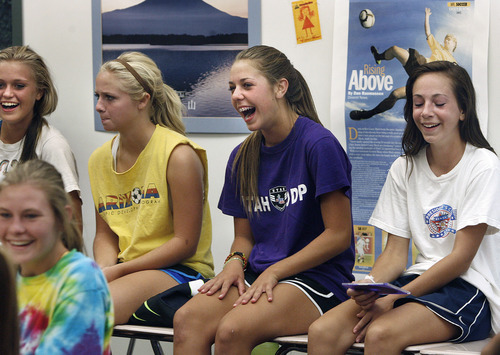 Scott Sommerdorf  |  The Salt Lake Tribune             
Riley Jacobs Ireland Dunn, second from right, laughs with team members, including Regyn Youngberg, second from left, and Riley Jacobs, far right, during a team meeting Friday, September 14, 2012. Dunn, a freshman on the Davis girls soccer team is having a terrific season.